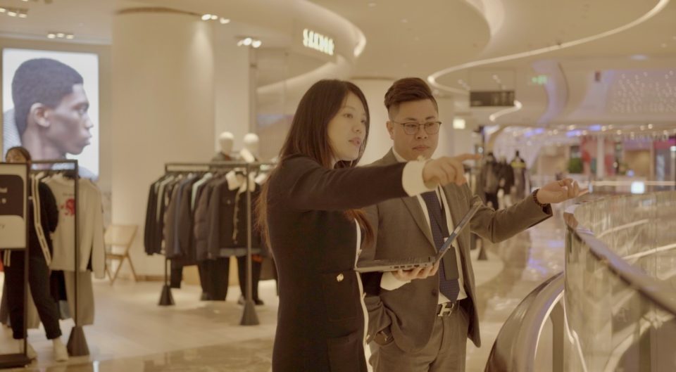 Aden Group head of facility management talks with Galeries Lafayette Shanghai site manager