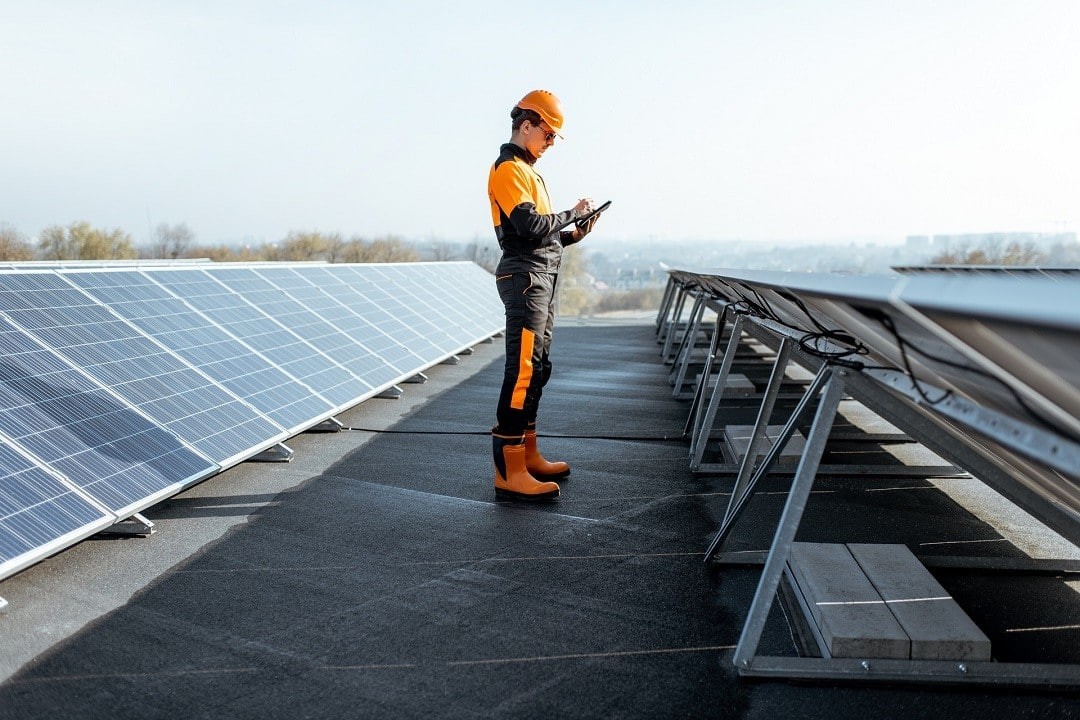 Solar panel engineers are working on the microgrid installation.